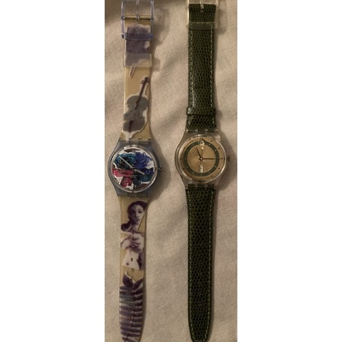 79 - Two as new Swatch watches, one music themed strap, one with crocodile effect strap.