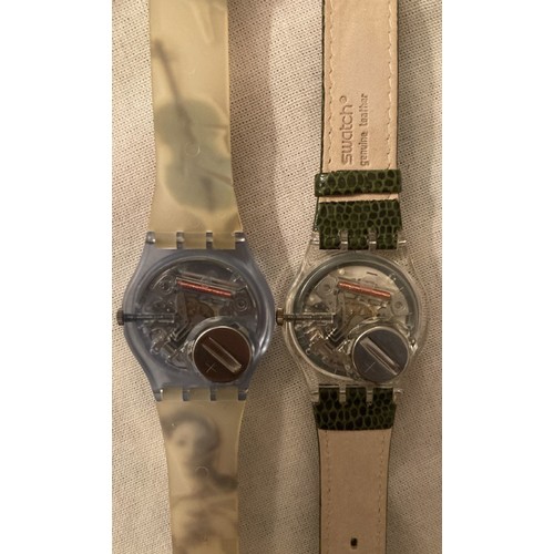 79 - Two as new Swatch watches, one music themed strap, one with crocodile effect strap.