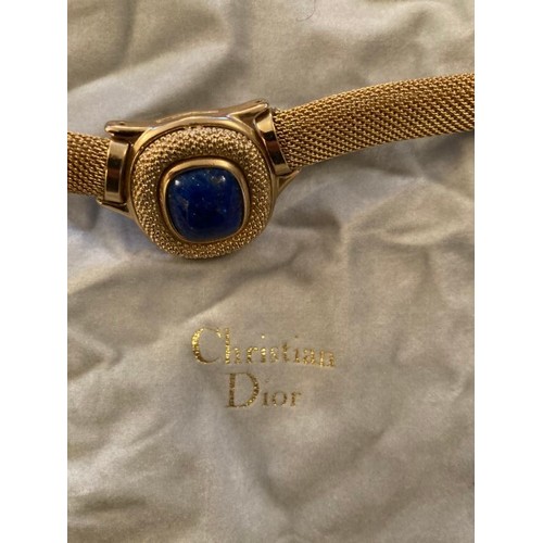 92 - A Christian Dior yellow metal necklace set with a blue stone marked Christian Dior Germany Giusse.