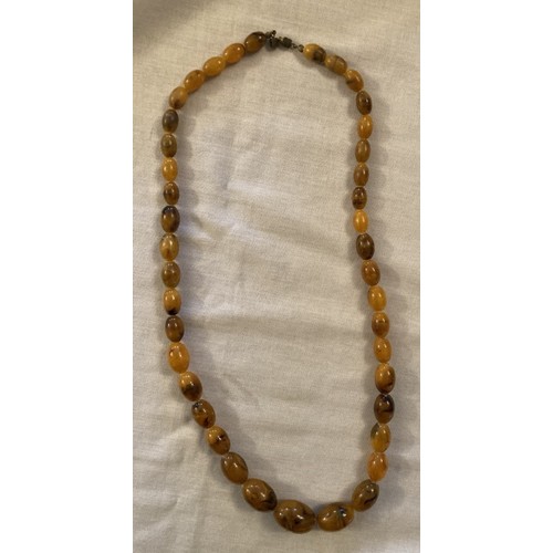 96 - Possibly amber bead necklace with 41 graduating beads, 74cm L, 64g.