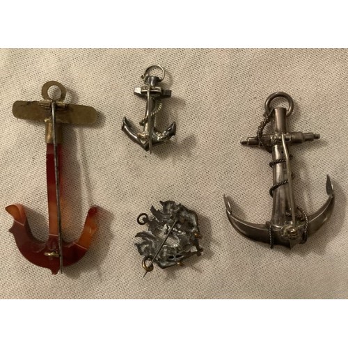 97 - Four various anchor shaped brooches, silver and yellow metal.