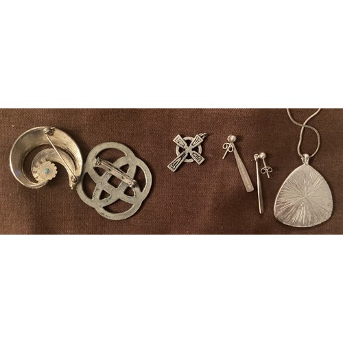 100 - A collection of pewter and white metal jewellery items.