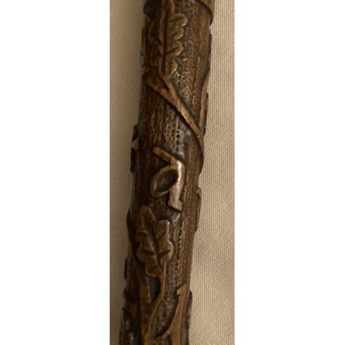 125 - A WWI walking cane and with upper stick carved oak leaves inscribed France 1919 with handle in the s... 