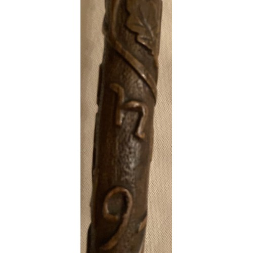 125 - A WWI walking cane and with upper stick carved oak leaves inscribed France 1919 with handle in the s... 