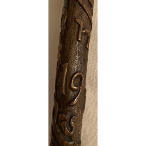 125 - A WWI walking cane and with upper stick carved oak leaves inscribed France 1919 with handle in the s... 