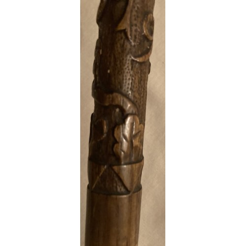 125 - A WWI walking cane and with upper stick carved oak leaves inscribed France 1919 with handle in the s... 