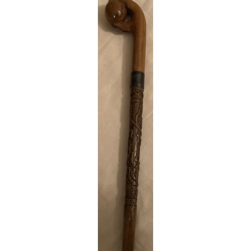 125 - A WWI walking cane and with upper stick carved oak leaves inscribed France 1919 with handle in the s... 