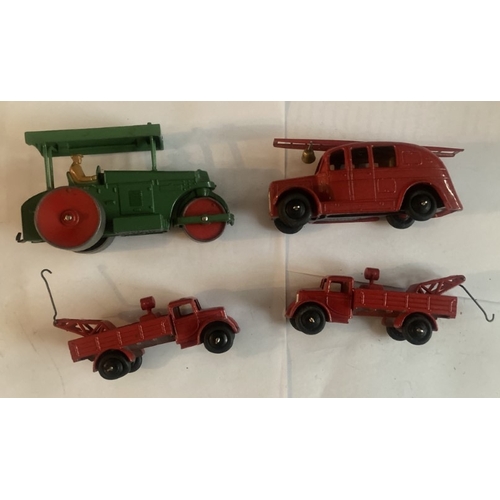 444 - A collection of four early Dinky Meccano model vehicles - road roller, Streamlined fire engine and t... 