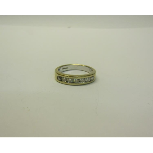 191 - An 18ct gold Diamond set half eternity ring - ring size P.