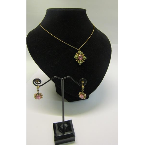 194 - An 18ct gold Pink Sapphire and Seed Pearl pendant necklace together with earrings.