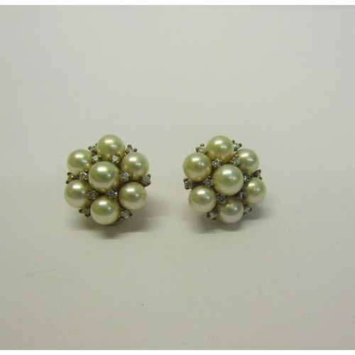 205 - A pair of gold Pearl and Diamond set earrings