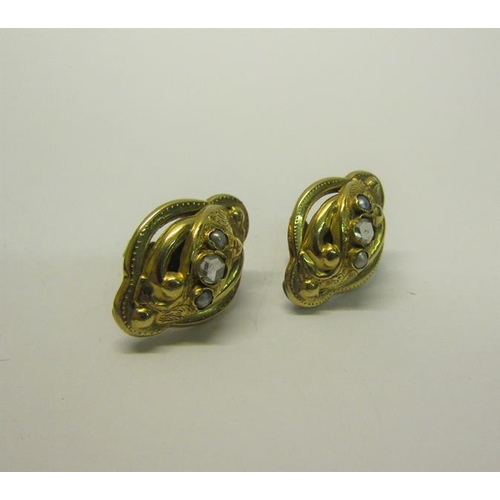 206 - A pair of gold Diamond set earrings