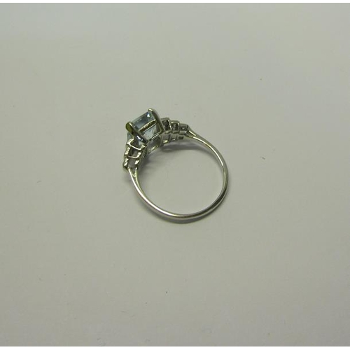 209 - A platinum art deco style ring set with Aquamarine and Diamonds. ring size O.