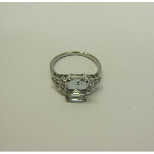 209 - A platinum art deco style ring set with Aquamarine and Diamonds. ring size O.