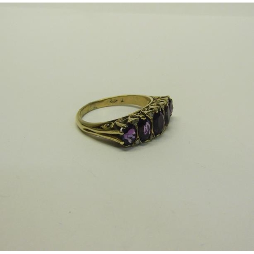 210 - A gold five stone ring set with five cut Amethysts.  Ring size P/Q.