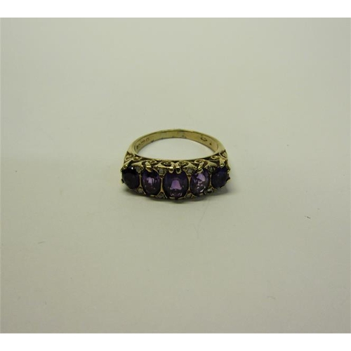 210 - A gold five stone ring set with five cut Amethysts.  Ring size P/Q.