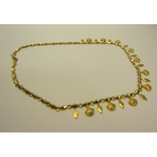 213 - An 18ct gold necklace with pendant drops and diamond shaped links.  40cms l. 18g.