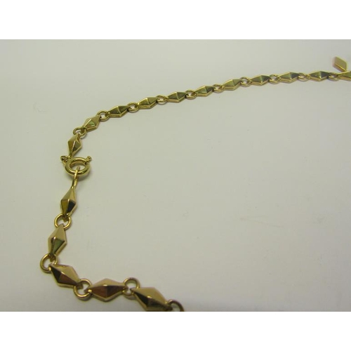 213 - An 18ct gold necklace with pendant drops and diamond shaped links.  40cms l. 18g.