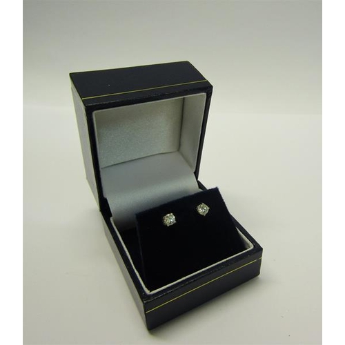 216 - An 18ct gold diamond stud earrings, approx 1/2 carat total.