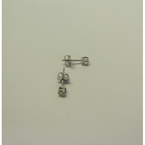 216 - An 18ct gold diamond stud earrings, approx 1/2 carat total.