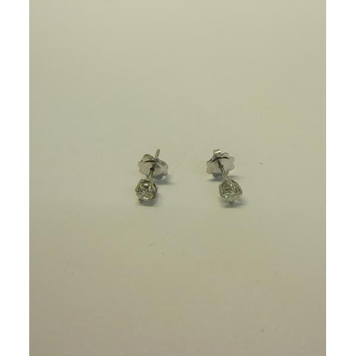 216 - An 18ct gold diamond stud earrings, approx 1/2 carat total.