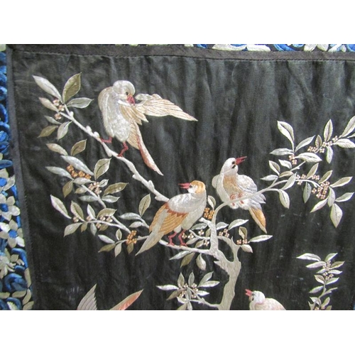 418 - A 19th century Chinese silk embroidered panel depicting birds in a tree with berries and blossom on ... 