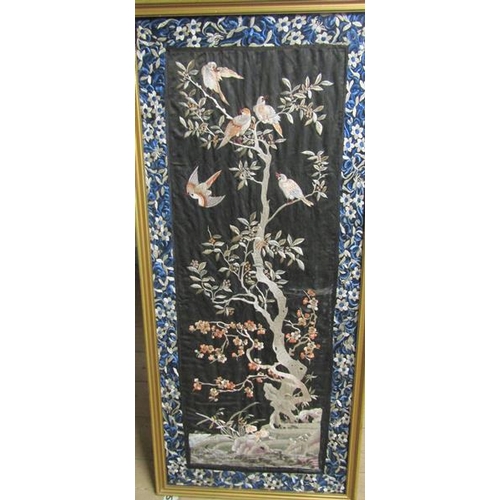 418 - A 19th century Chinese silk embroidered panel depicting birds in a tree with berries and blossom on ... 