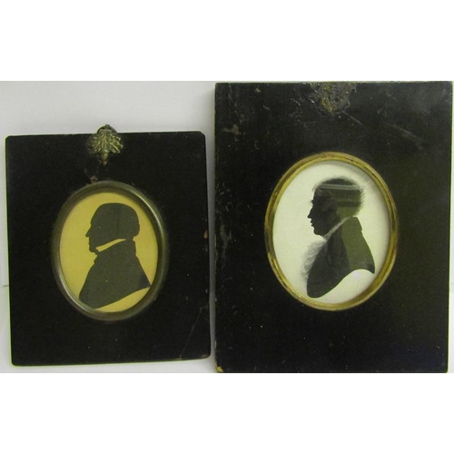 123 - Two 19c black on white silhouette portrait miniatures of gentleman.  Oval framed and glazed.  7cms x... 