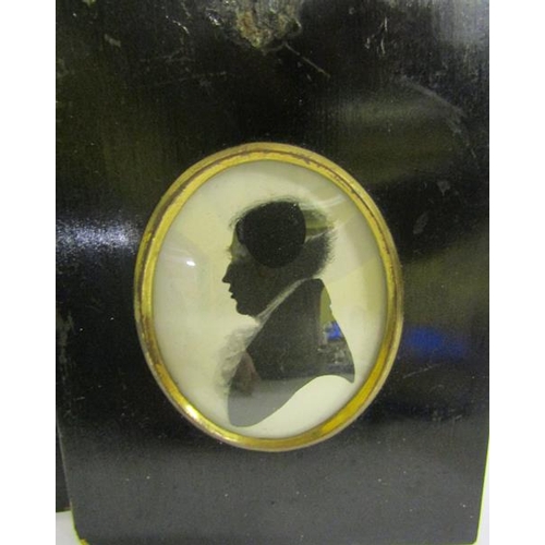 123 - Two 19c black on white silhouette portrait miniatures of gentleman.  Oval framed and glazed.  7cms x... 