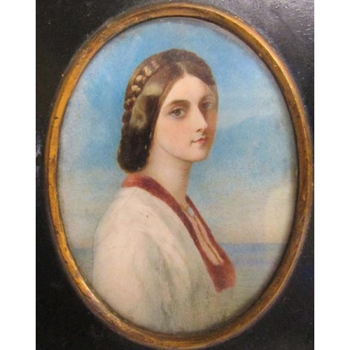 125 - A 19c watercolour portrait of a lady, oval framed and glazed.  11cms x 8cms.