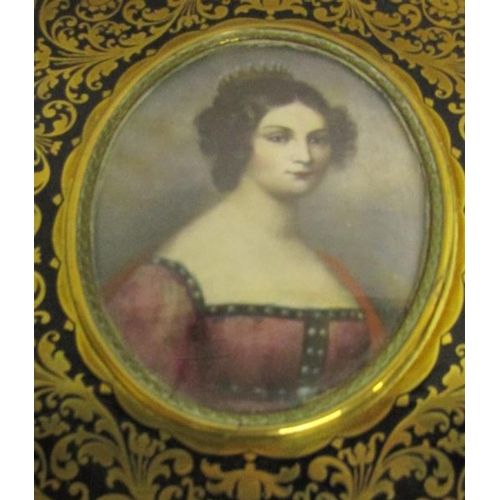 127 - A portrait miniature of a lady wearing a tiara in an oval brass frame.  6.5cms x 8.5cms.