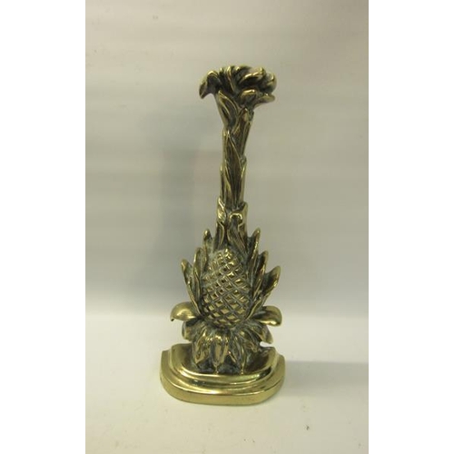 48 - A 19c brass and iron door stop in the form of a pineapple.  34cms h.