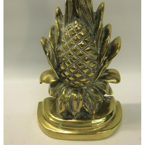 48 - A 19c brass and iron door stop in the form of a pineapple.  34cms h.