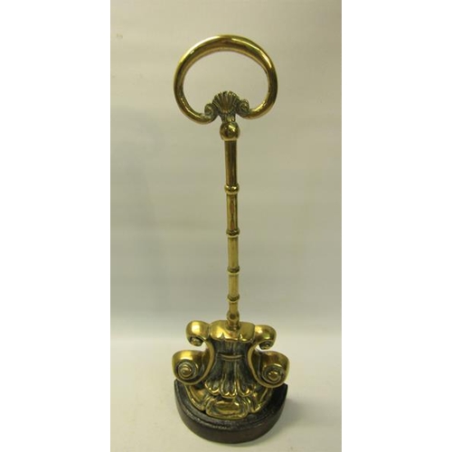 49 - A 19c brass and iron doorstop with central carry handle.  38cms h.