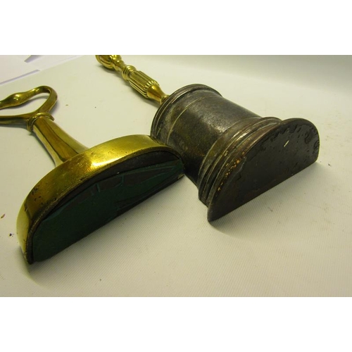 51 - Two 19c brass and iron doorstops both with carry handles, one with base marked AK & Sons for Keswick... 