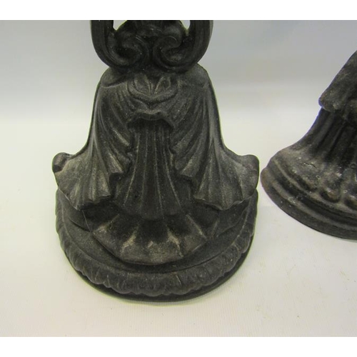 52 - A 19c Kenrick cast iron door stop 34cms h, together with a similar 18cms h.