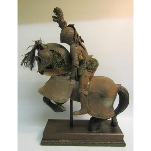 72 - A late 19c miniature Knight's armour for man and horse in 16c style, the horse of carved wood fitted... 