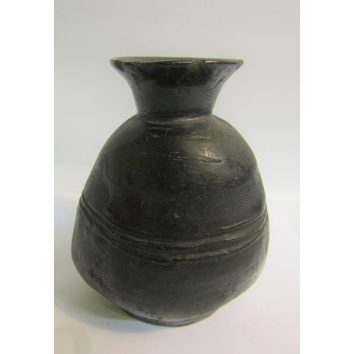 74 - A Raku style pottery facial vase, 16cms h.