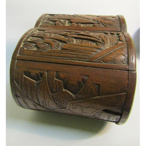 85 - A late 19/early 20c Oriental box of lobed form, panel carved with village and coastal scenes.  32cms... 