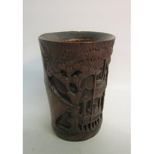 87 - A 19c Oriental bamboo brush pot carved in high relief with village in a bamboo setting.  12cms dia x... 