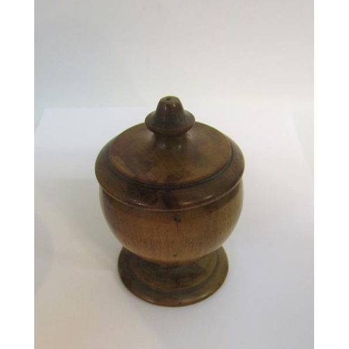 92 - A 19c Fruitwood nutmeg grater in the form of a turned wood cup on stand with lift of cover carrying ... 