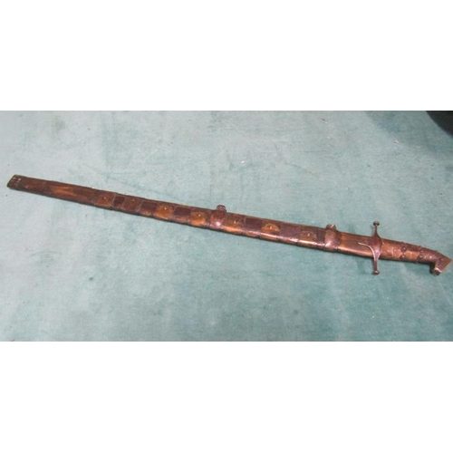 3 - An Arabic Khevsors sword and sheath with a 70cm blade.  81cms l overall.