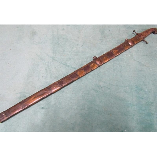 3 - An Arabic Khevsors sword and sheath with a 70cm blade.  81cms l overall.