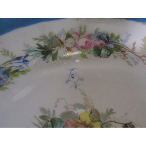 55 - A 19c Sevres style porcelain bowl painted with panels of flowers on a blue background. Supported in ... 