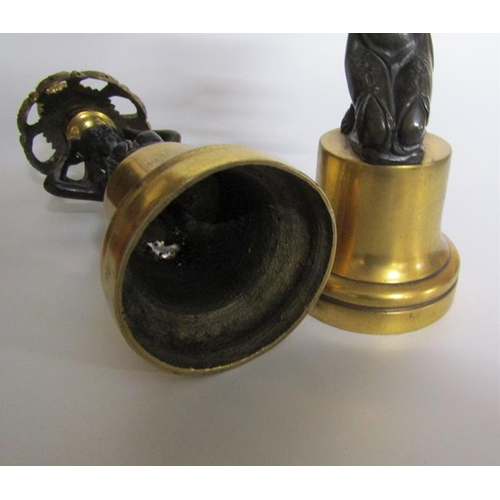 61 - A pair of late 19c ormolu and patinated bronze figurine candlesticks with swag cast socles on circul... 