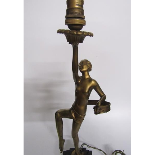 64 - An art deco gilt metal dancing figure table lamp supported on stepped marble base, electrolier.  The... 