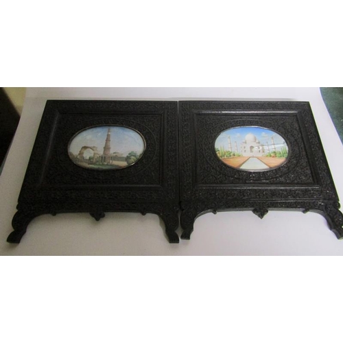 65 - Late 19c Indian oval painted miniatures of the Taj Mahal and Qutub Minar Tower, both in carved ebony... 