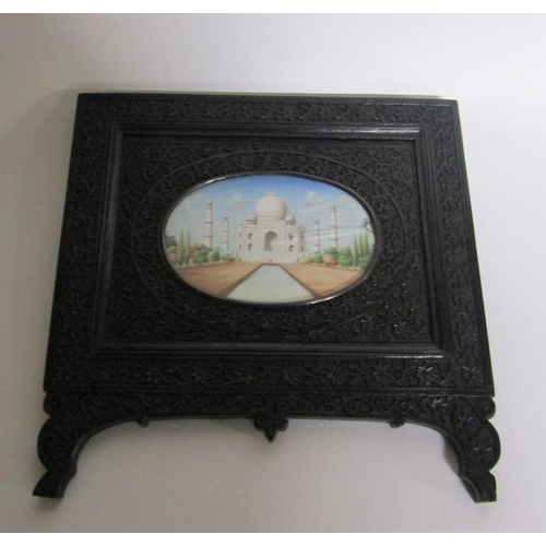 65 - Late 19c Indian oval painted miniatures of the Taj Mahal and Qutub Minar Tower, both in carved ebony... 