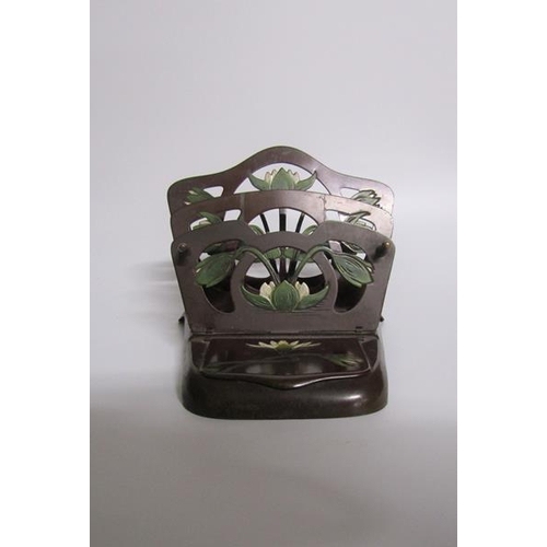 67 - An art nouveau letter stand stamped DJM 237670 E S. Gesch.  Bronze patinated, the three divisions fo... 