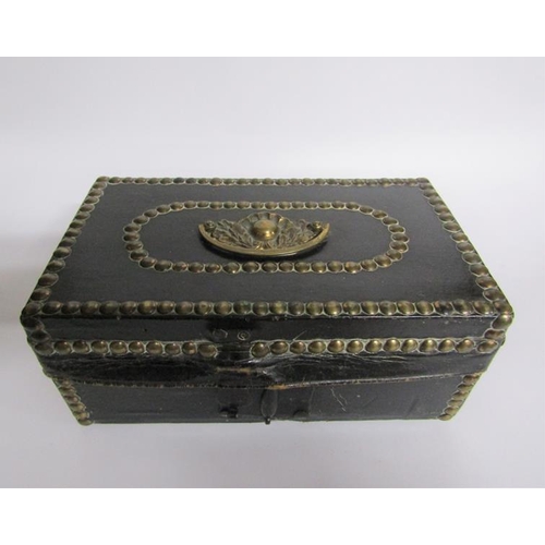 78 - A George III leather and brass studded small trunk, paper lined and with a label Charles M Domett.  ... 